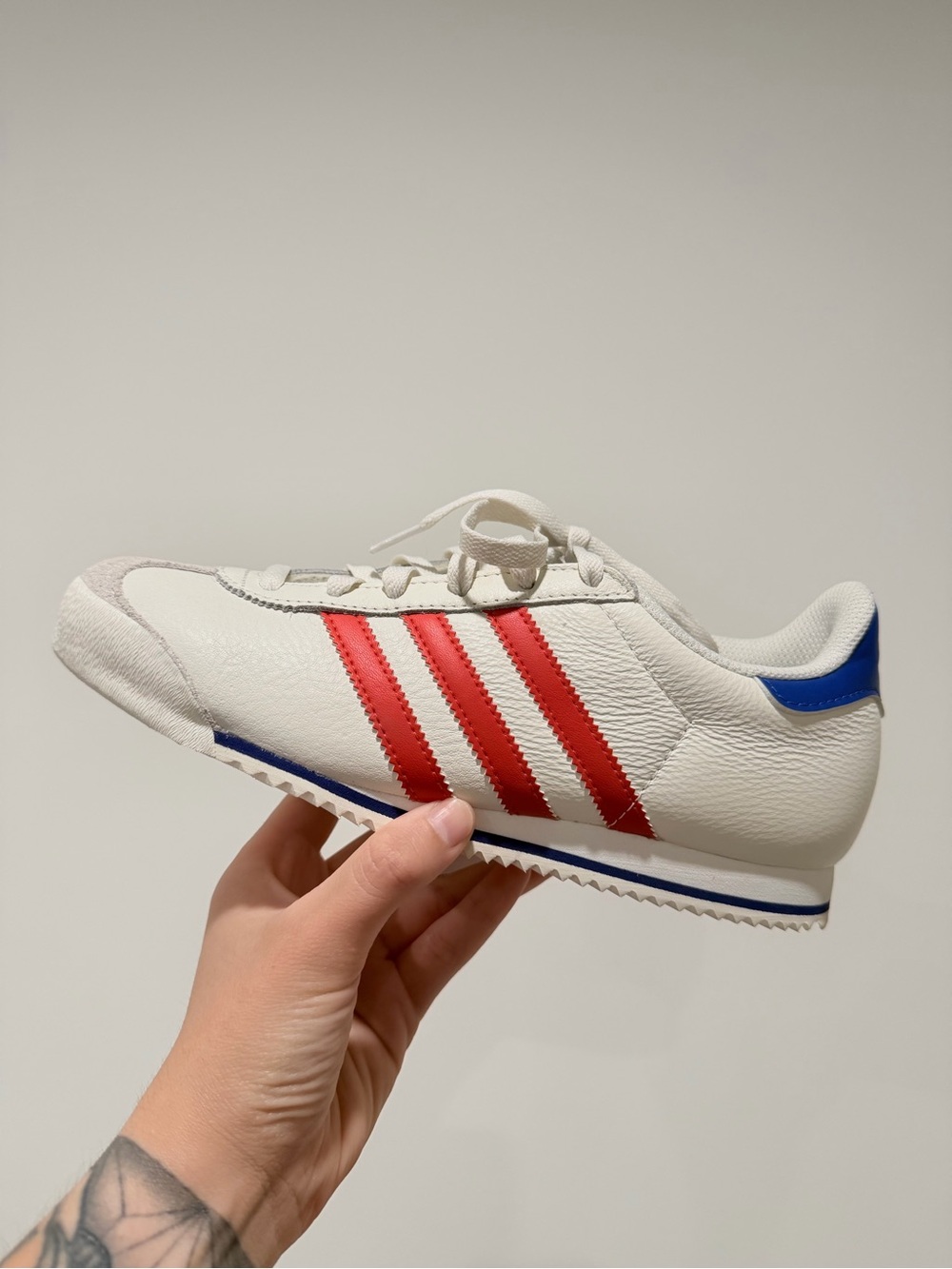 Adidas Classic White Sneaker with Red Stripes and Blue Heel